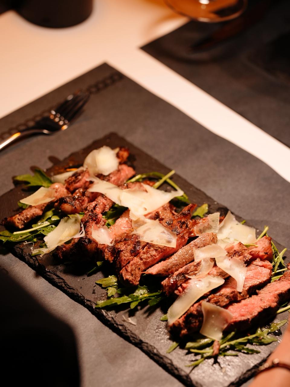 Sliced grilled steak at Corner Pizza and Grill